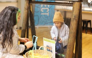 child and mother making art at sparks activity event at the Children's Museum at JBLM